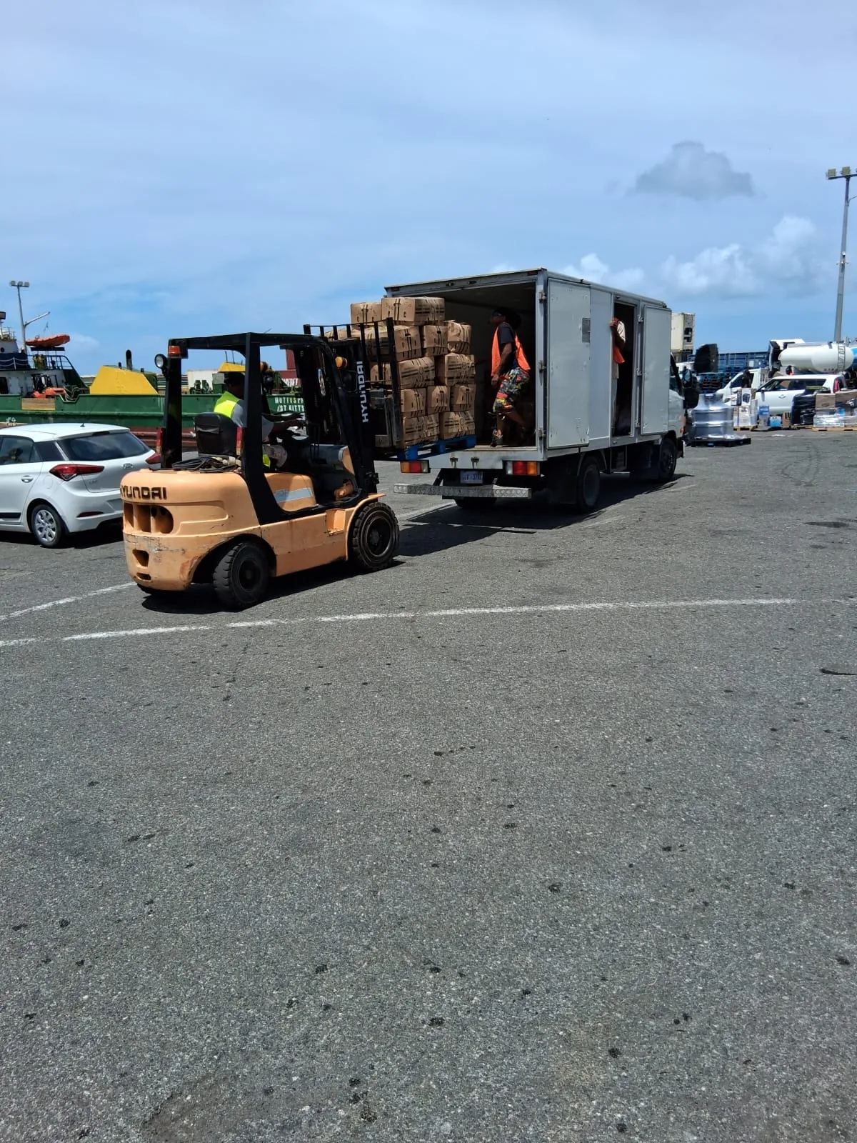 Pallets of produce loaded onto our truck at the port